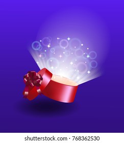 Opened red gift box with bright light rays and sparkle.