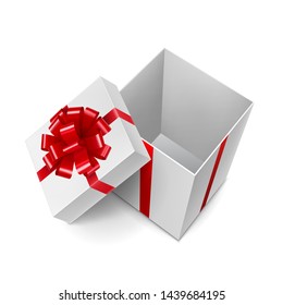 Opened white cube shaped gift box with shiny red ribbon. New year and Chrismas surprise with tape decoration. Side view of realistic empty container isolated on white vector illustration
