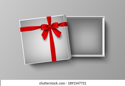 Opened white empty gift box with red bow and ribbon, vector illustration