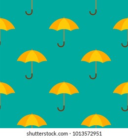 Opened yellow umbrellas. Seamless diagonal vector background. Pattern with umbrellas for rainy weather. Bright modern design for fabric and clothing.