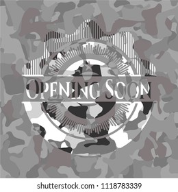 Opening Soon written on a grey camouflage texture