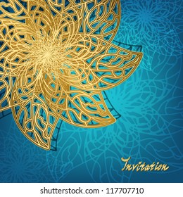 Openwork golden snowflake on a blue background, the idea for an invitation or Christmas card