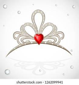 Openwork jewelry tiara with diamonds and faceted red stone in a heart shape on white background
