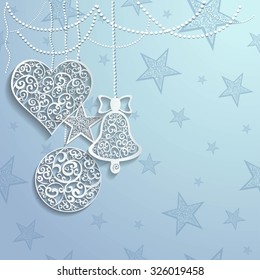 Openwork moon, heart, star and ball on grey winter background