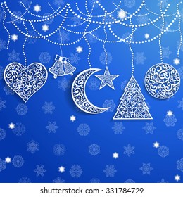 Openwork moon, heart, star, christmas tree and ball on blue winter background