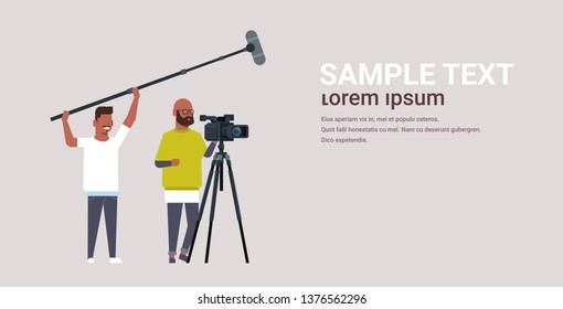 operators using video camera on tripod holding microphone african american men working with professional equipment recording movie making film production concept horizontal copy space
