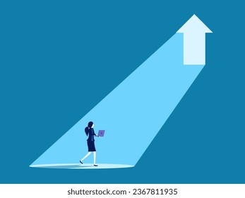 Opportunity for growth. Businesswoman looks at the light from the arrow door