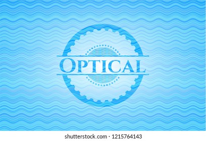 Optical light blue water wave badge.