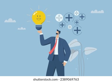 Optimism attitude or positive thinking, Emotional intelligence inspires and brings happiness in work and life, Happy businessman holding a light bulb concept smiles in a positive atmosphere.