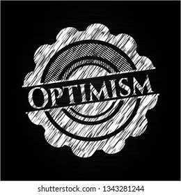 Optimism chalkboard emblem written on a blackboard