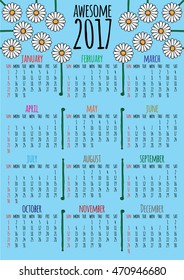 Optimistic floral 2017 vector calendar. Week starts with sunday. You can see hand drawn daisy flowers, title that says AWESOME 2017, and colorful month names. Blue background.