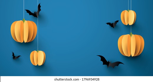 Orange 3d paper pumpkins hanging on threads on blue background. Black paper bats. Space for text. Vector festive illustration.