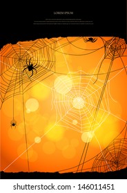 Orange background with spiders and web with space for text