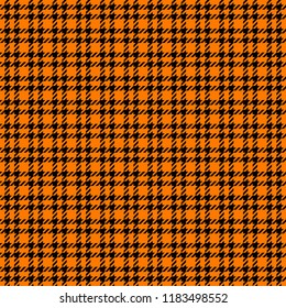 
Orange and Black Houndstooth Tartan Seamless Vector Pattern Tile. Halloween Background. High Fashion Textile Print. Dog tooth Check Fabric Texture. Pattern Tile Swatch Included.