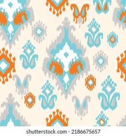 Orange and blue color digital ikat pattern for creating beautiful fabrics design and other elements of the fashion industry and home interior. Adras  - traditional Uzbek ornament, produced in Margilan