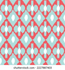 Orange and blue color ikat pattern - traditional art, silk fabric, beautiful background. Fashion industry.