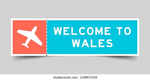 Orange and blue color ticket with plane icon and word welcome to wales on gray background