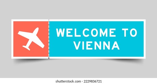 Orange and blue color ticket with plane icon and word welcome to vienna on gray background