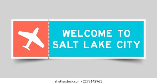 Orange and blue color ticket with plane icon and word welcome to salt lake city on gray background