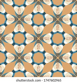 Orange and blue vector folk tulips seamless pattern with dot fills. Regularly repeating geometric flowers. Rhombus tessellating structure for wallpaper, interior textiles and fashion fabrics.