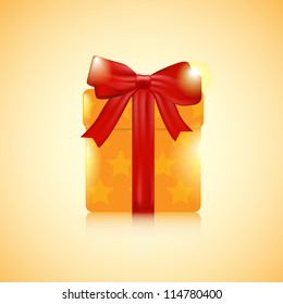 An orange Christmas present width a red bow and ribbon on an orange background.