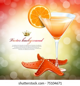 Orange cocktail in a glass and a starfish