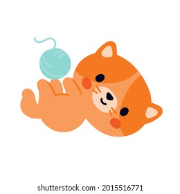 Orange cute kitten is playing with a ball. Isolated cat on a white background