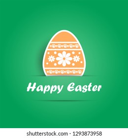 orange Easter egg with patterns on green background