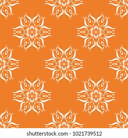 Orange floral ornament with white elements. Seamless pattern for textile and wallpapers