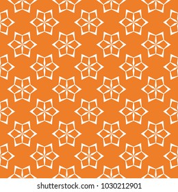 Orange floral ornament with white elements. Seamless pattern for textile and wallpapers