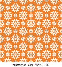 Orange floral ornament with white elements. Seamless pattern for textile and wallpapers