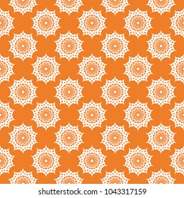 Orange floral ornament with white elements. Seamless pattern for textile and wallpapers