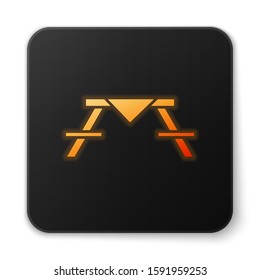 Orange glowing neon Picnic table with benches on either side of the table icon isolated on white background. Black square button. Vector Illustration