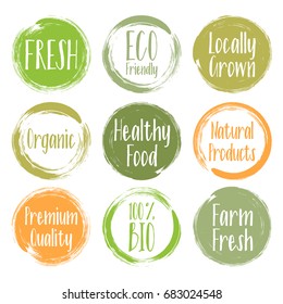 Orange and green vector organic labels, bio emblems collection for menu or natural products packaging. Fresh, vegan, raw food, eco friendly, premium quality, locally grown, healthy food stickers.