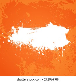 Orange grunge background with white splat in the centre