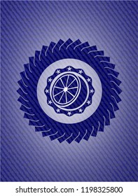 orange icon inside badge with denim background