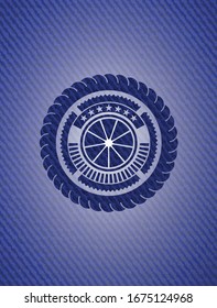 orange icon inside badge with denim background