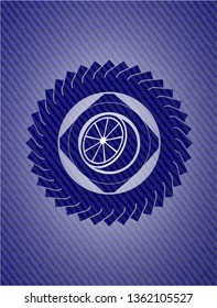 orange icon inside badge with jean texture