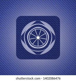 orange icon inside badge with jean texture