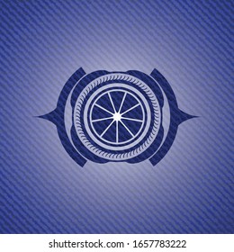 orange icon inside badge with jean texture