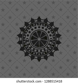 orange icon inside black emblem