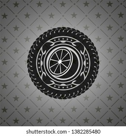 orange icon inside black emblem
