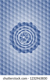 orange icon inside blue emblem or badge with abstract geometric polygonal pattern background.