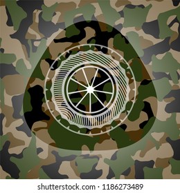 orange icon inside camo emblem