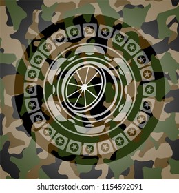 orange icon inside camouflaged emblem