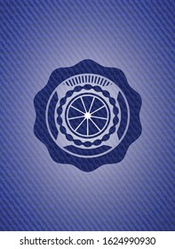 orange icon inside denim background