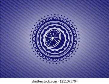 orange icon inside emblem with denim texture
