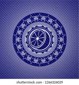 orange icon inside emblem with denim high quality background