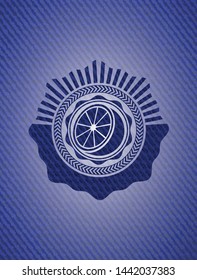 orange icon inside emblem with denim high quality background