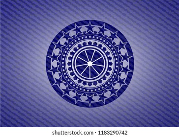 orange icon inside emblem with jean background